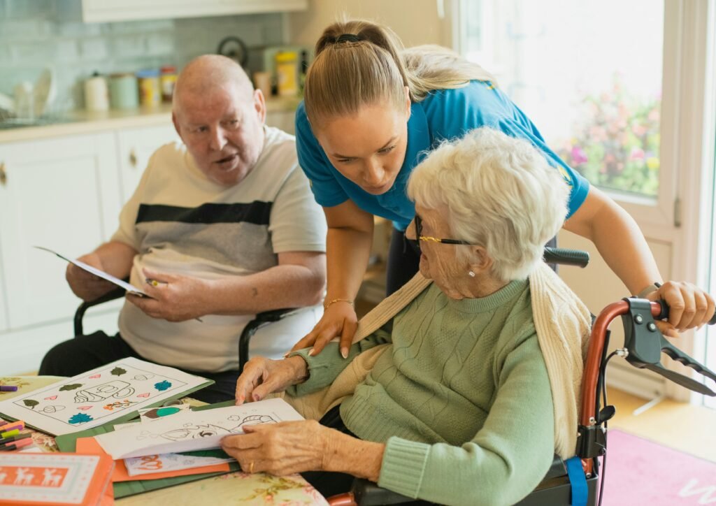 professional nurse helping senior couple at their home to help with assisted living and daily activities in mesa arizona